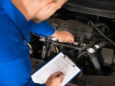 Mechanic Doing Inspection State Of Maryland Vehicle Inspection